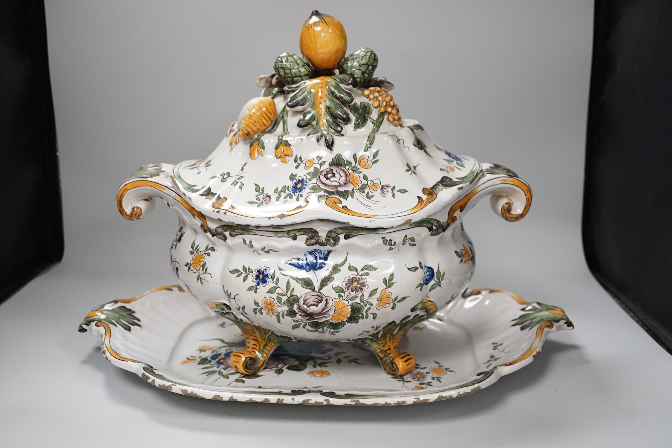 A 19th century French faience large tureen, cover and stand, 49cm wide